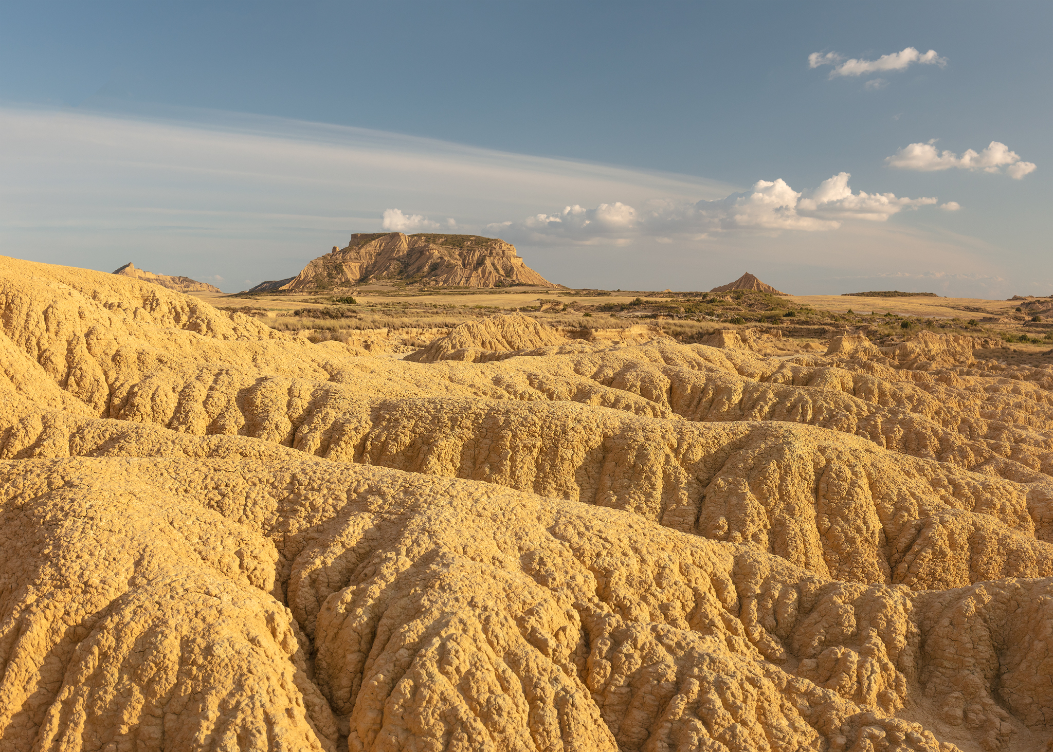 Fine art photograph of blue sky and clouds over the Navarra desert plains in Spain. Photo by landscape photographer, Serena Dzenis.