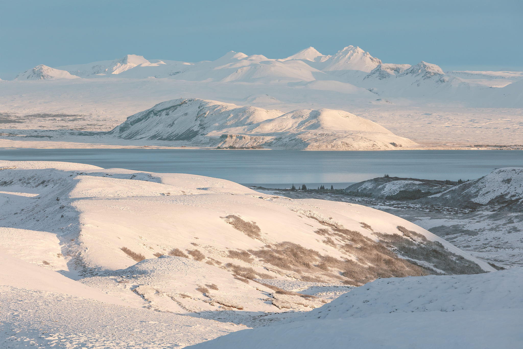 Telephoto landscape photograph of snowy mountain peaks in Iceland during winter
