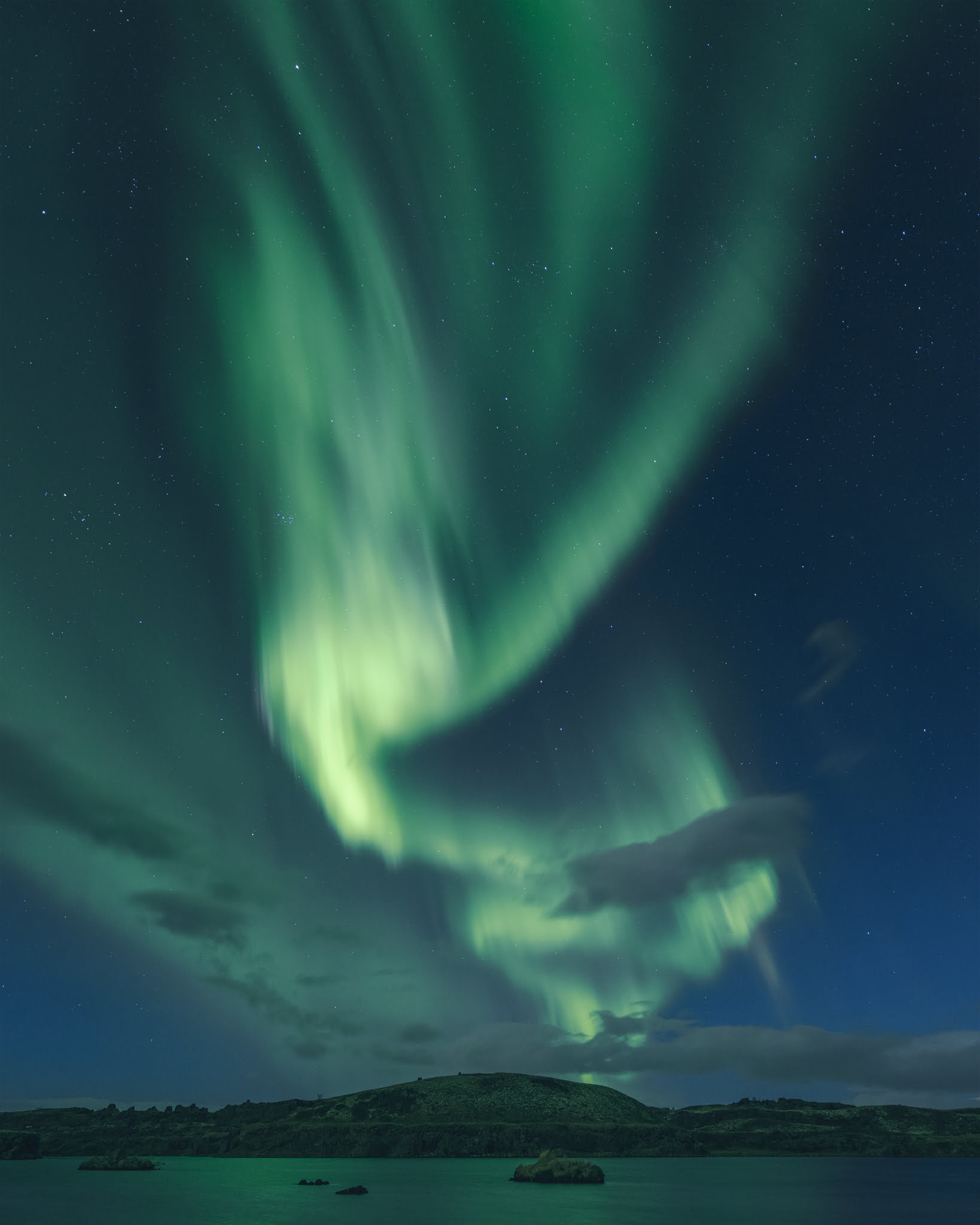 Landscape photograph of the Northern Lights or Aurora Borealis in Iceland